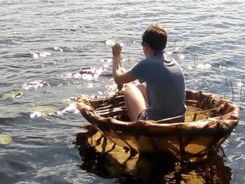 Completed coracle with reindeer skin covering the basketry frame.